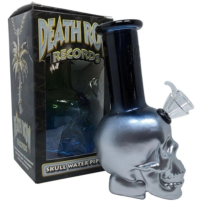 Silver skull-shaped water pipe with black accent next to a 'Death Row Records' box.