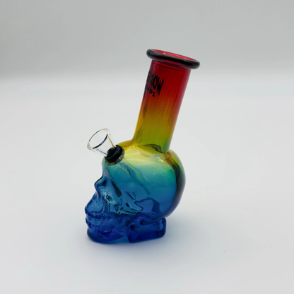 Colorful glass skull-shaped water pipe on a white background