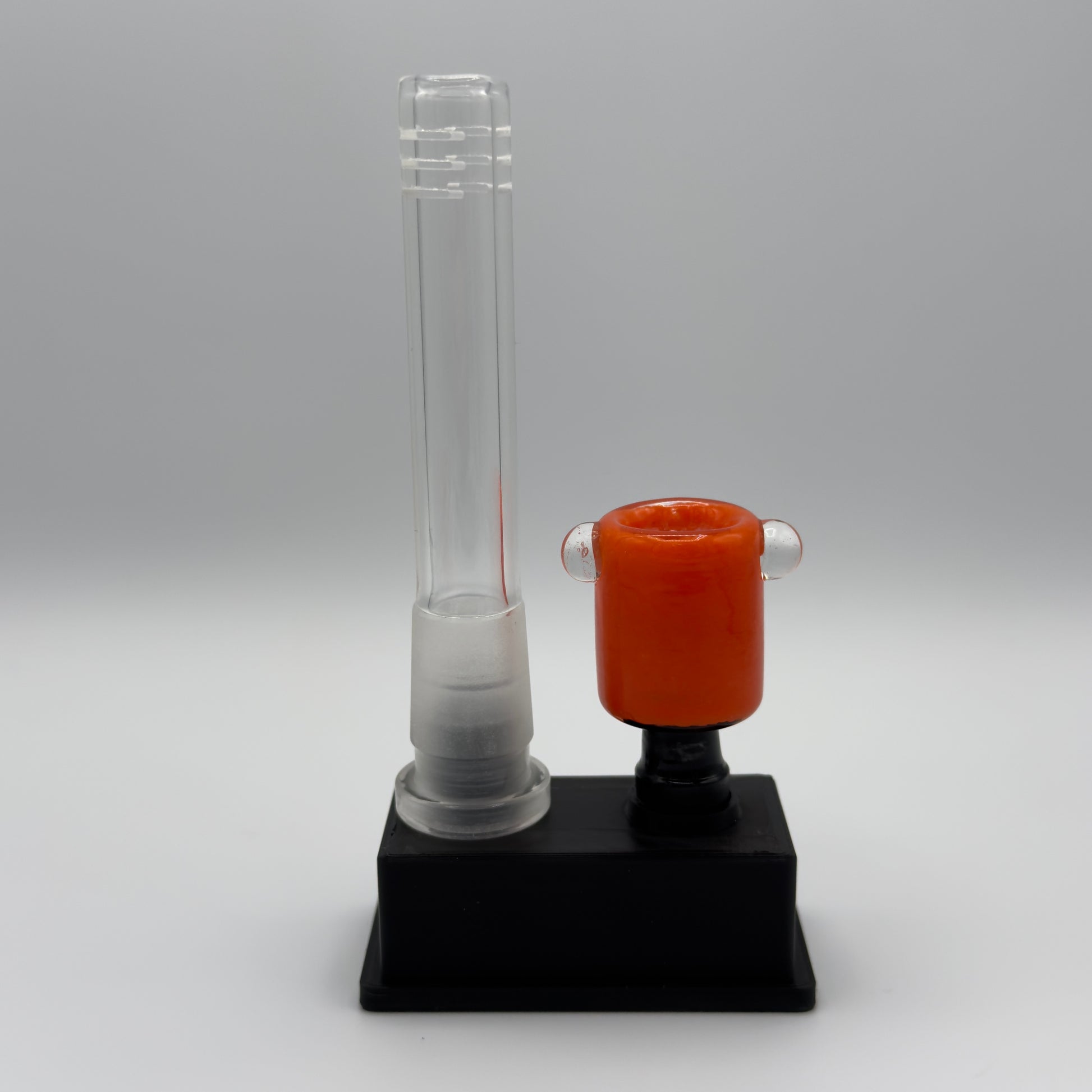 Clear Glass Downstem & black colorful slide on a dual display stand.