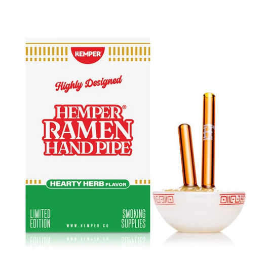 Hemper Ramen Hand Pipe packaging box shown next to two hand pipes resting in a small white bowl, on a clean white background.